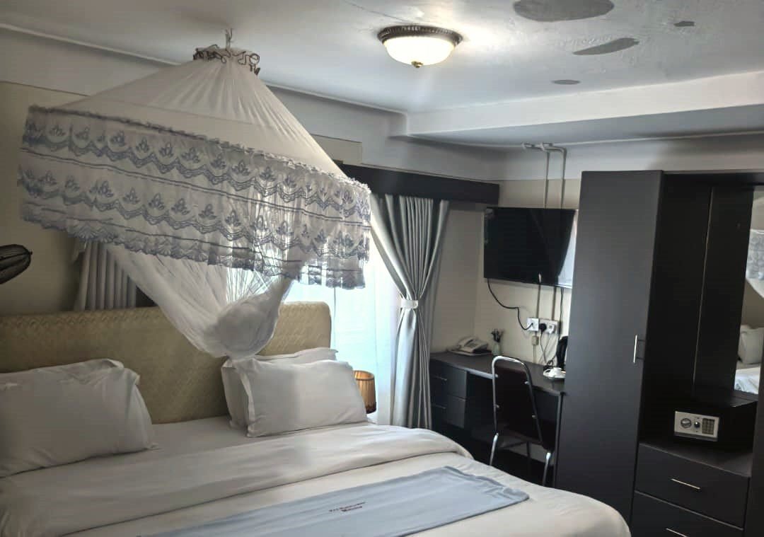 Executive AC room with TV, workspace and safe